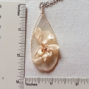 Floral necklace, amulet